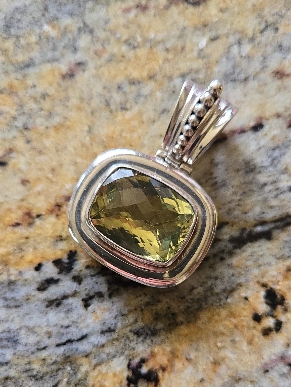 Sterling Silver Pendant with Yellow Faceted Gem